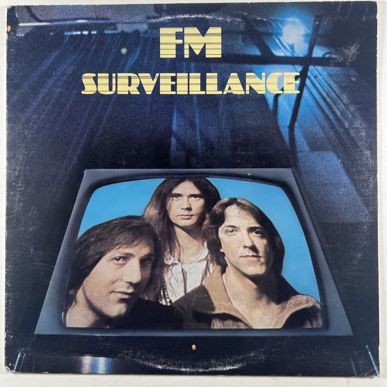 FM “Surveillance” LP/Passport Records PB 2001 (EX) 1979