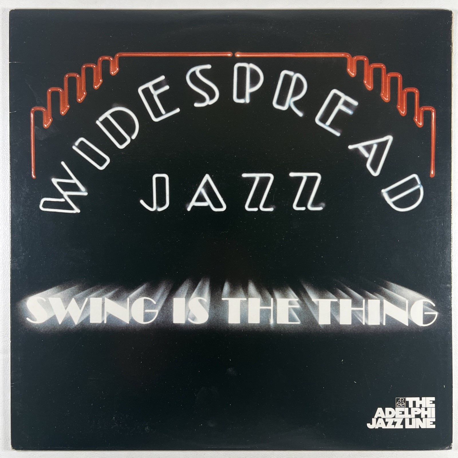 The Widespread Jazz Orchestra “Swing Is The Thing” LP/Adelphi (NM) 1983